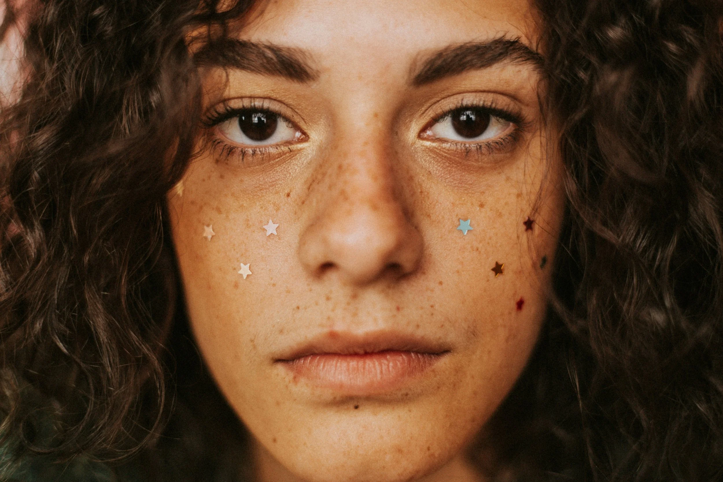 use of a tattoo machine to create a penciled in brow.