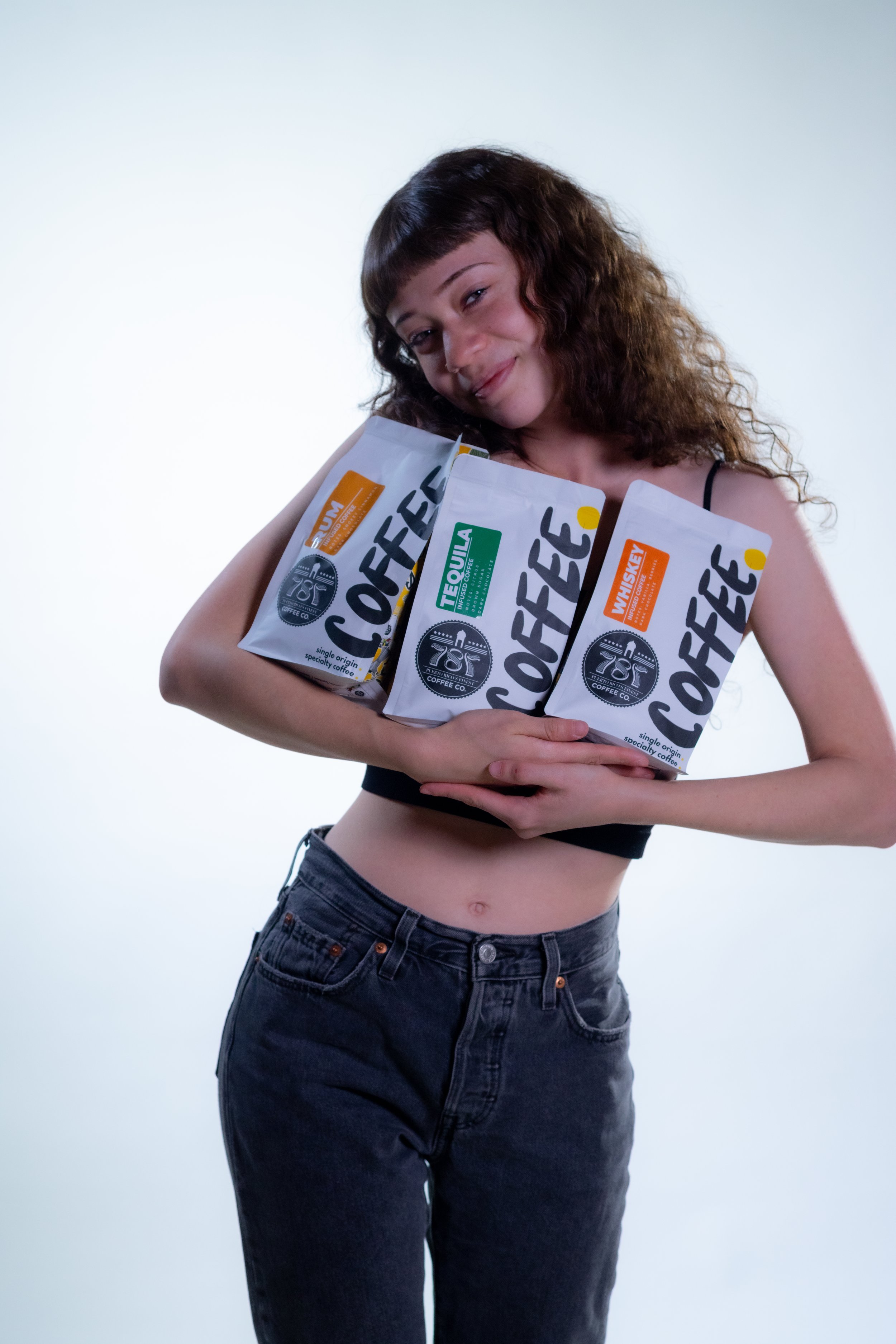 Girl smiling carrying the three infused coffee beans