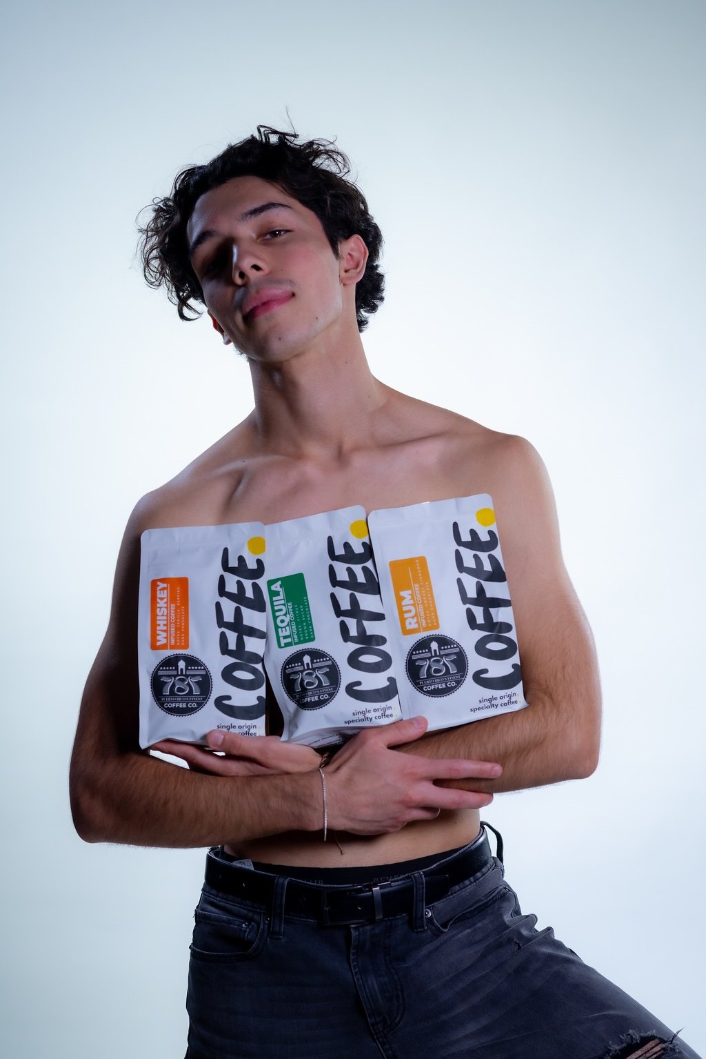 Man holding the three infused coffee beans 787 coffee