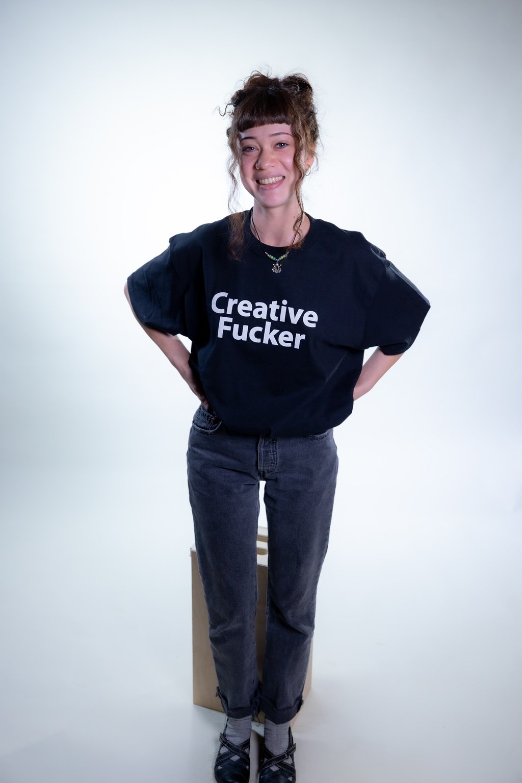 Female smiling wearing Creative Fucker
