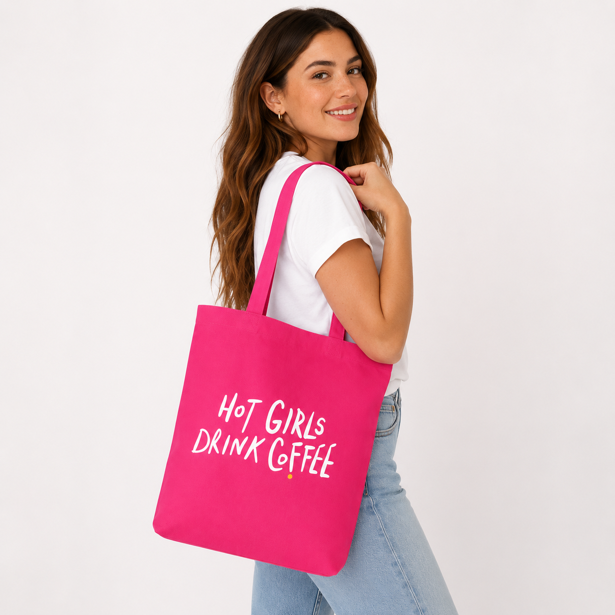 Hot Girls Drink Coffee hand-lettered design by 787 Coffee — cream white lettering with yellow dot on hot pink, limited-edition statement tote art