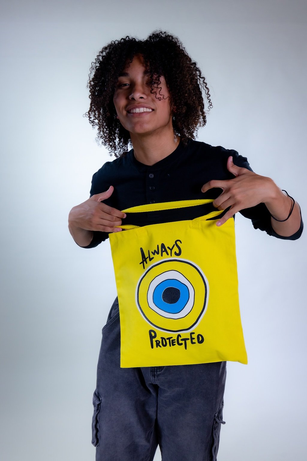 Male showing the always protected tote bag
