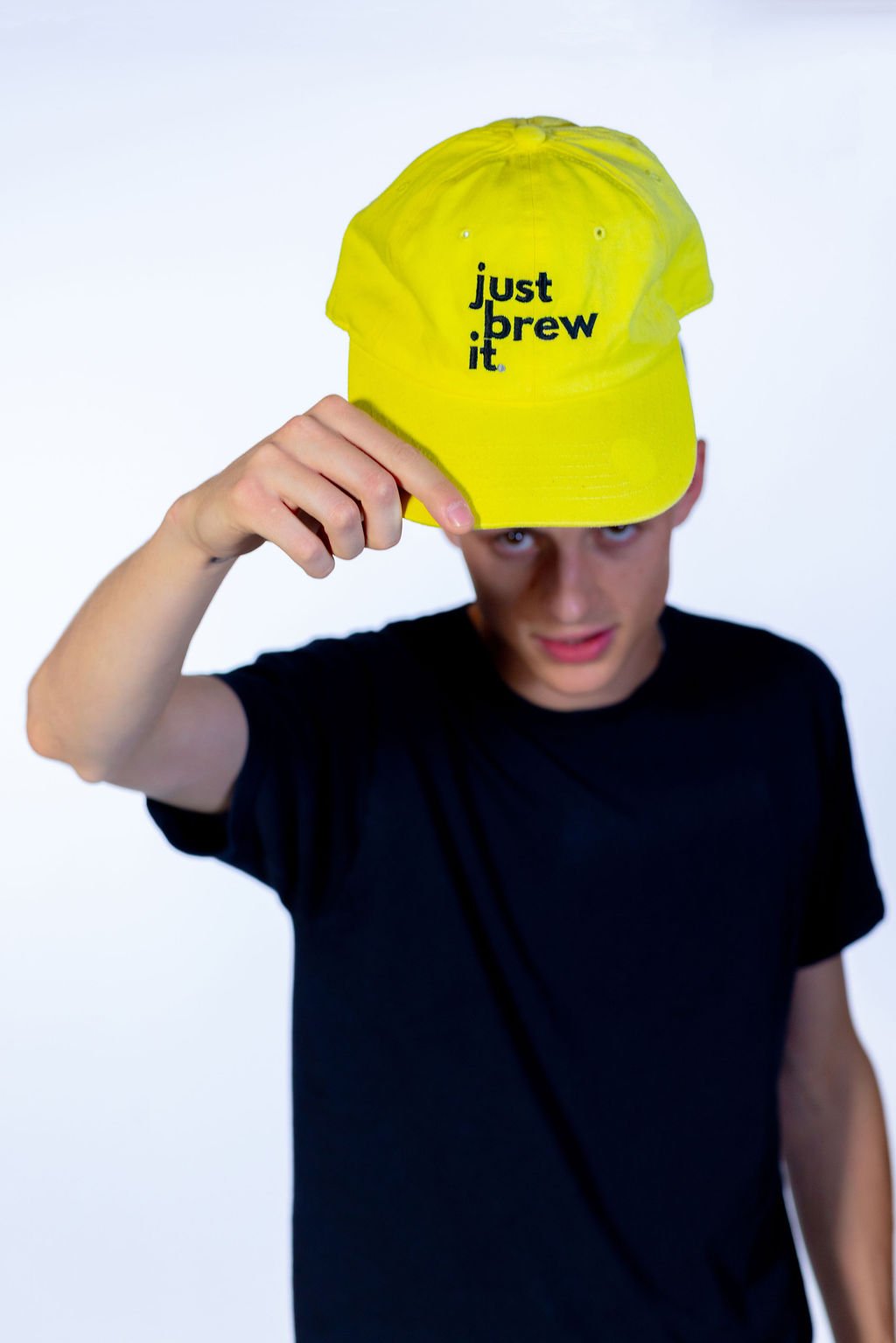 Just Brew It hat, with male showing the hat- by 787 coffee