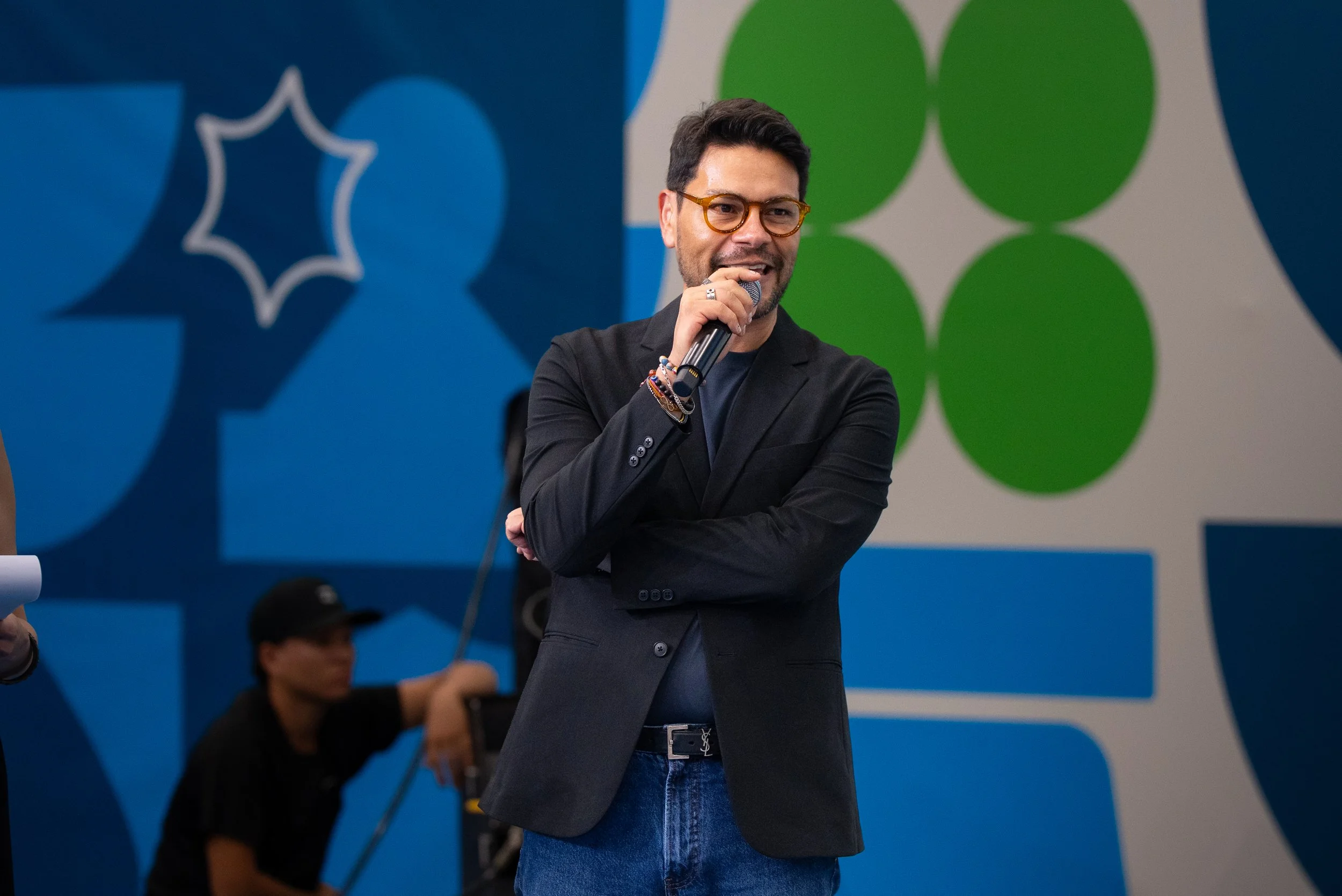 Brandon Ivan Peña, Co-founder and CEO of 787 Coffee, speaking on stage at World of Coffee Panama 2026 — representing 787 Coffee as a sponsor of the World Barista Championship and specialty coffee from Puerto Rico