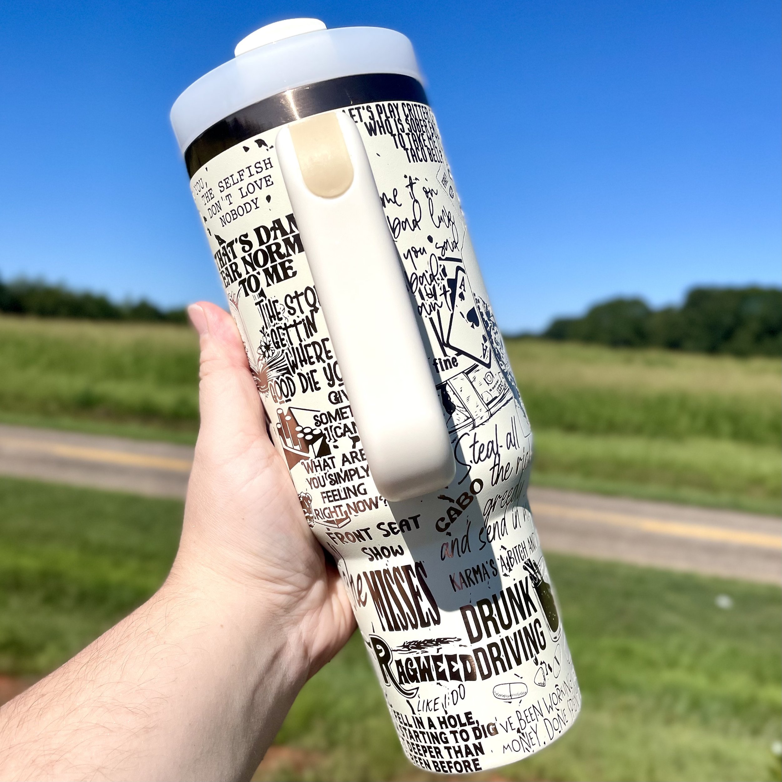 40oz Koe Wetzel country music fan tumbler shown in outdoor setting