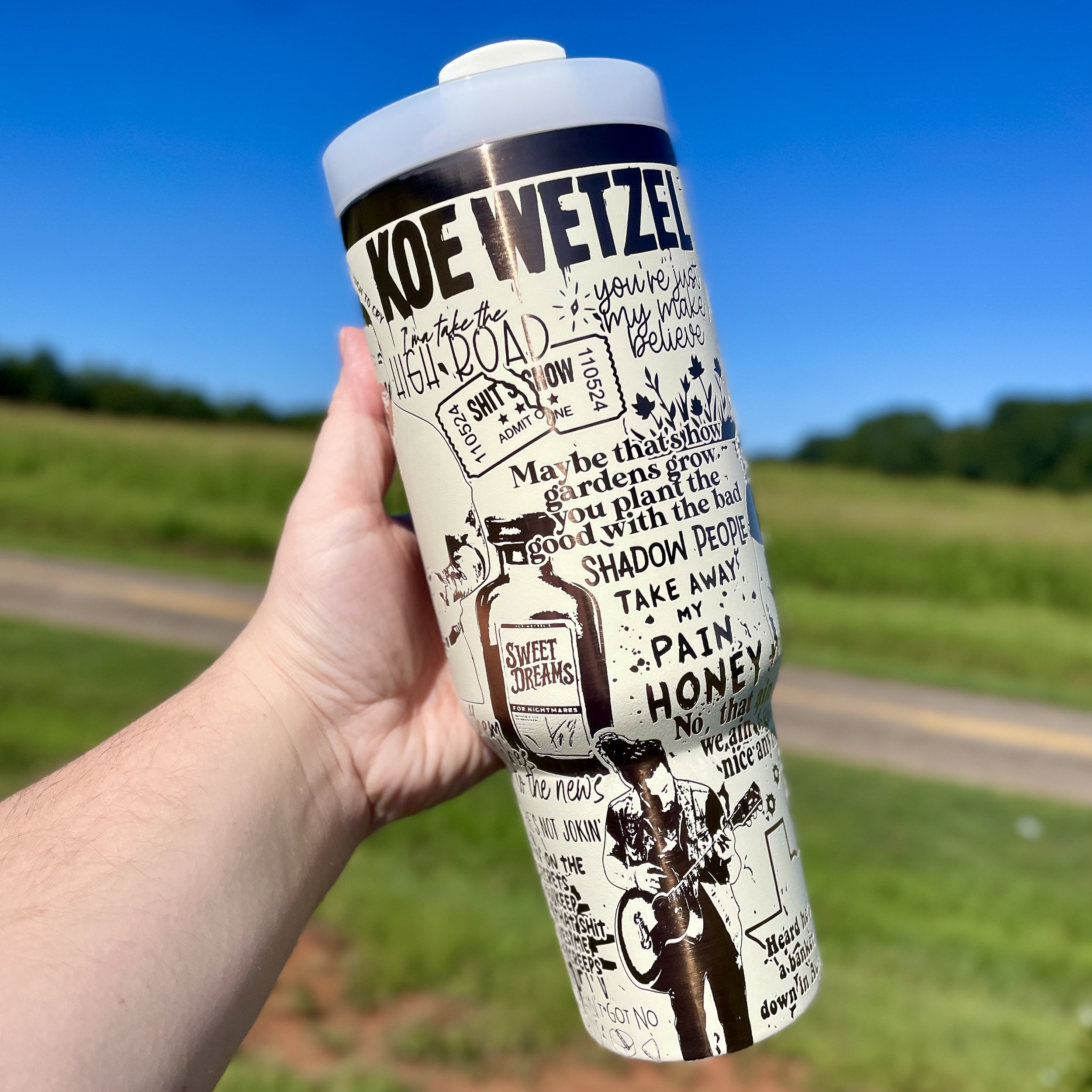 Side view of Koe Wetzel 40oz engraved tumbler with spill-resistant lid