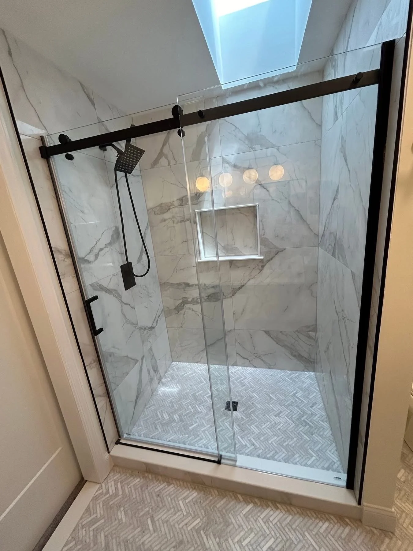Beautifully upgraded shower stall, with modern style semi frameless shower doors 