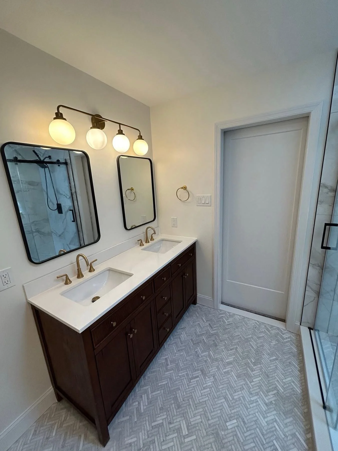 Complete bathroom makeover for this en suite primary bath; including installation of a pocket door, so as not to impede bathroom space or adjoining primary bedroom