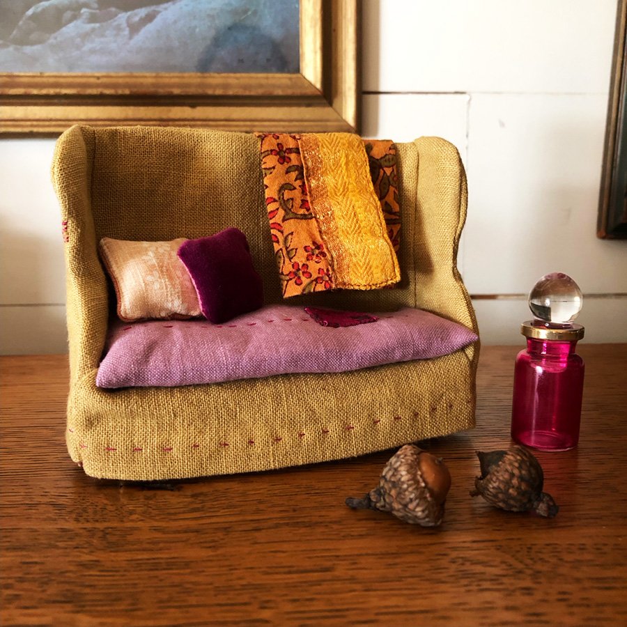 dollhouse sofa with mended cushion and velvet throw pillow by Phoebe Stout