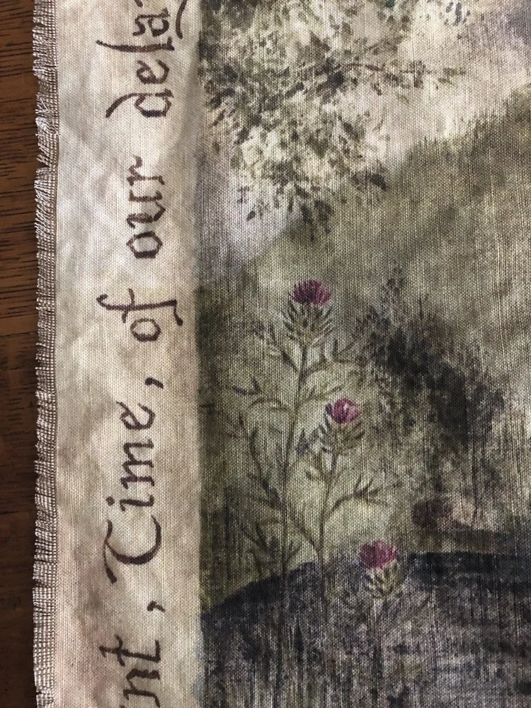 detail of gothis lettering and wild thistle on medieval-style wall tapestry by Talufane