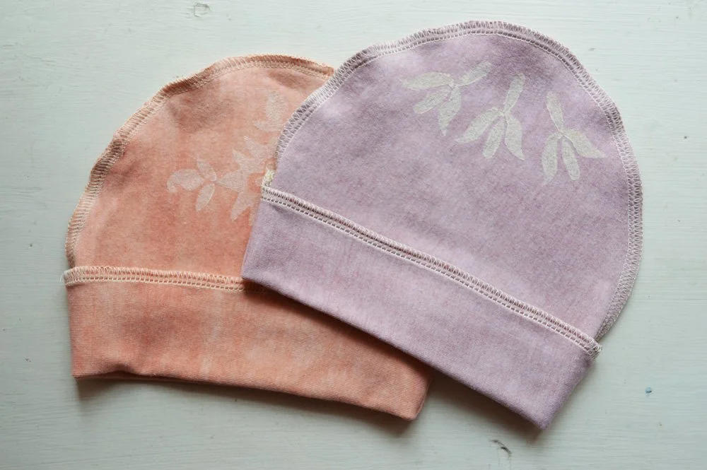 naturally-dyed block-printed baby hats by Untold Imprint