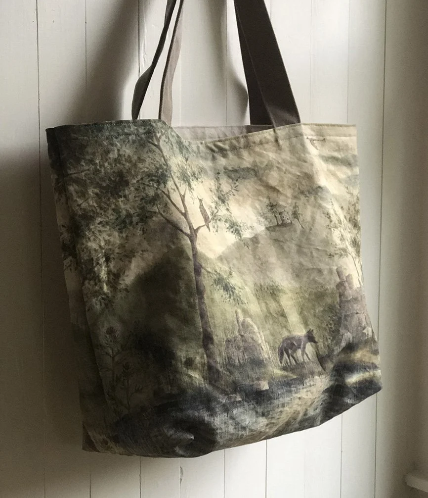 wolf, owl and dragon with ruins of castle painting and bag by Talufane