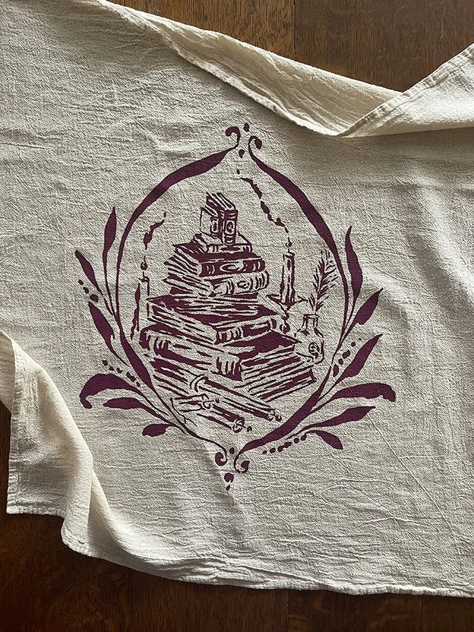 cotton towel with print of old books by Talufane