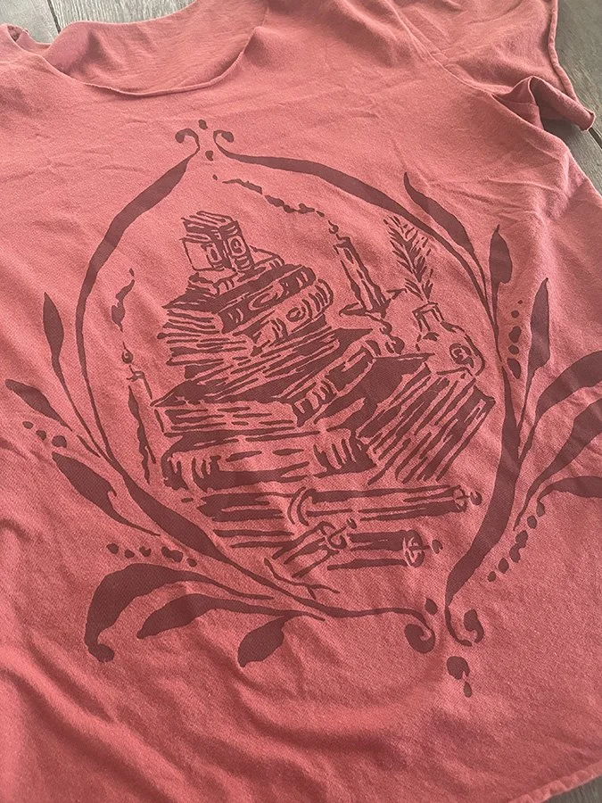 Stack of old books printed cotton tee by Talufane
