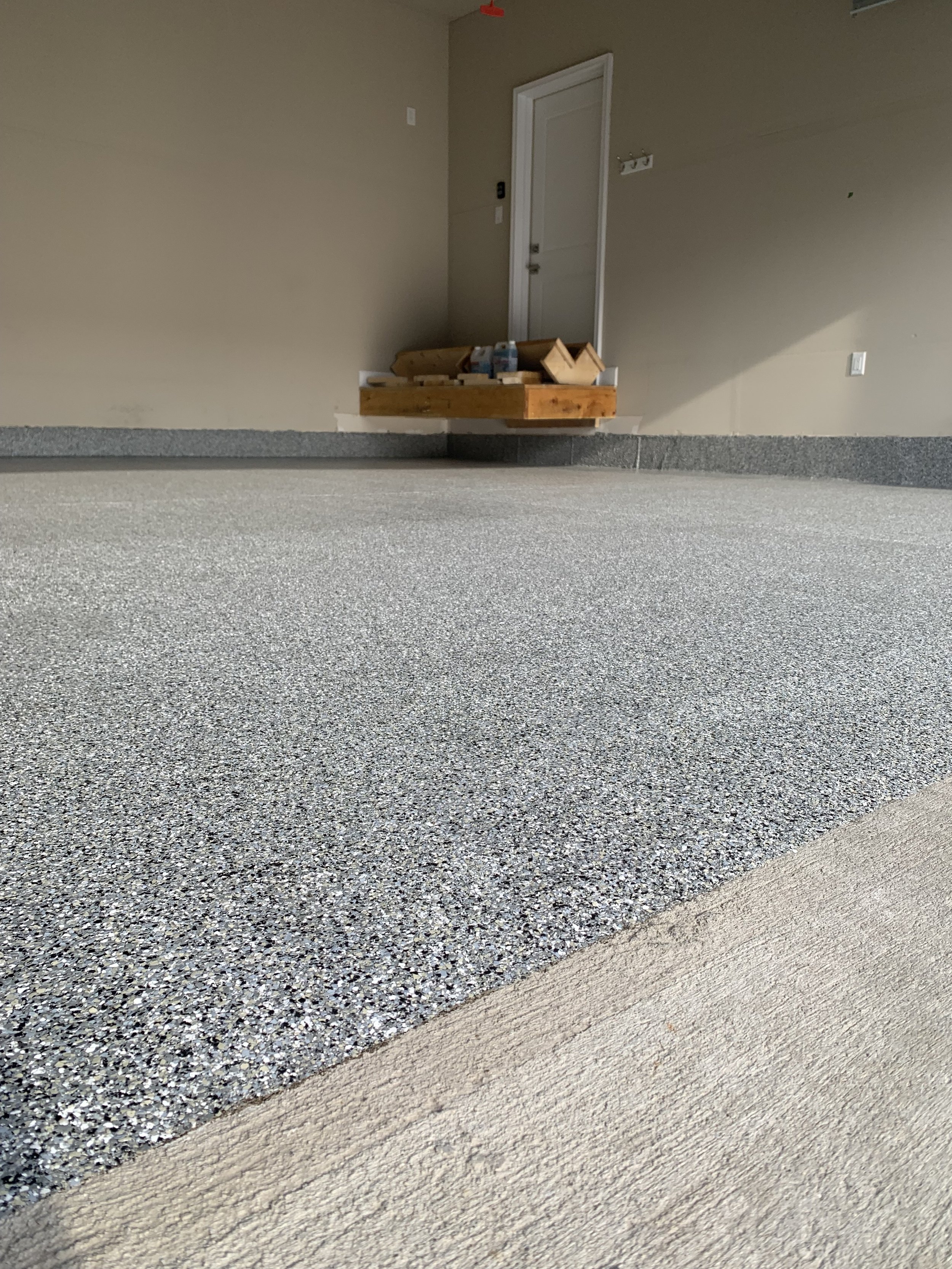 Granite paint flake floor system with top coat urethane for UV protection