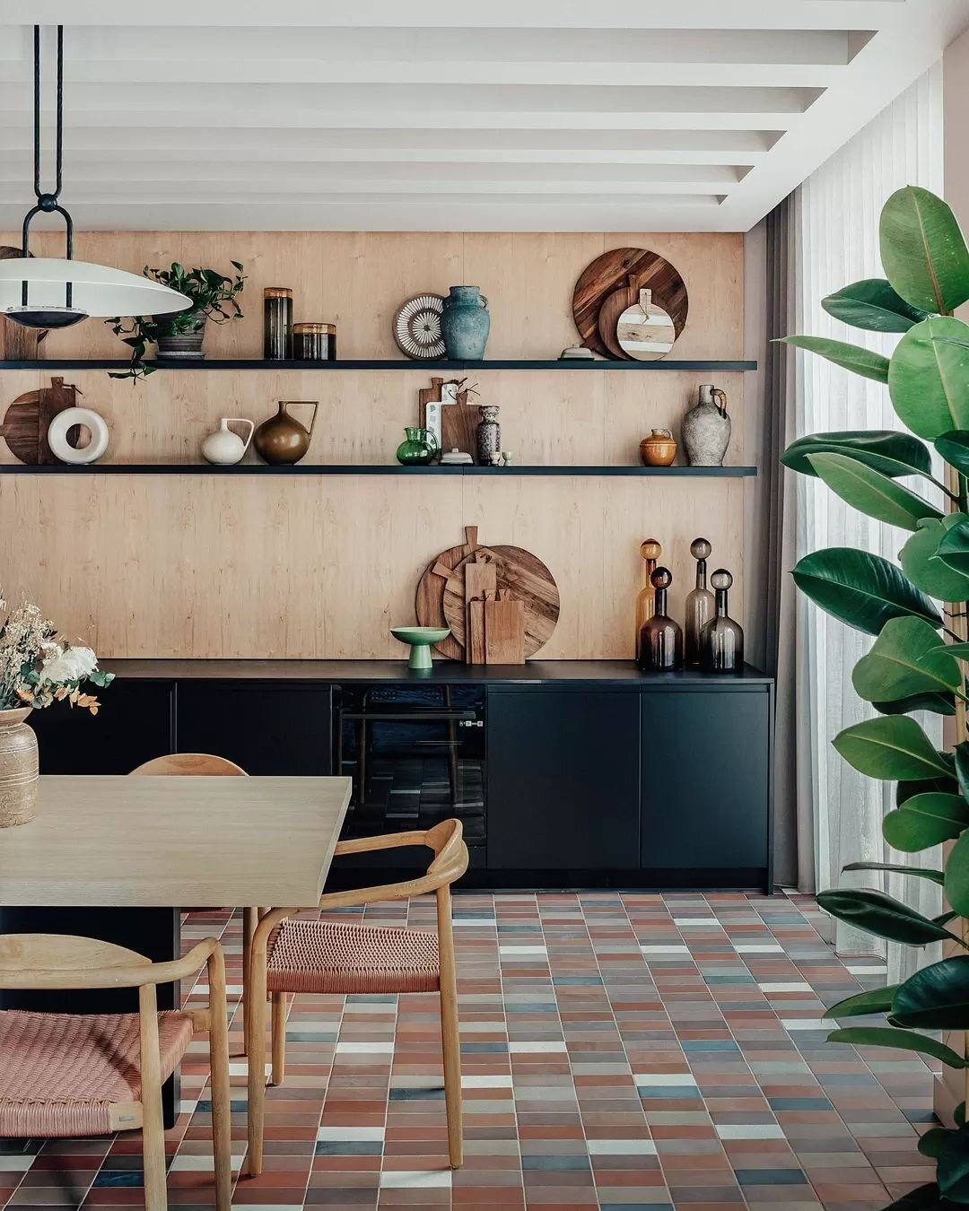 At @authorkingscross, collaborated with @conranandpartners and Related Argent, our communal courtyard kitchen is a symphony of light, texture, and design. The natural wood tone, woven accents, and serene greenery create a space where residents connec