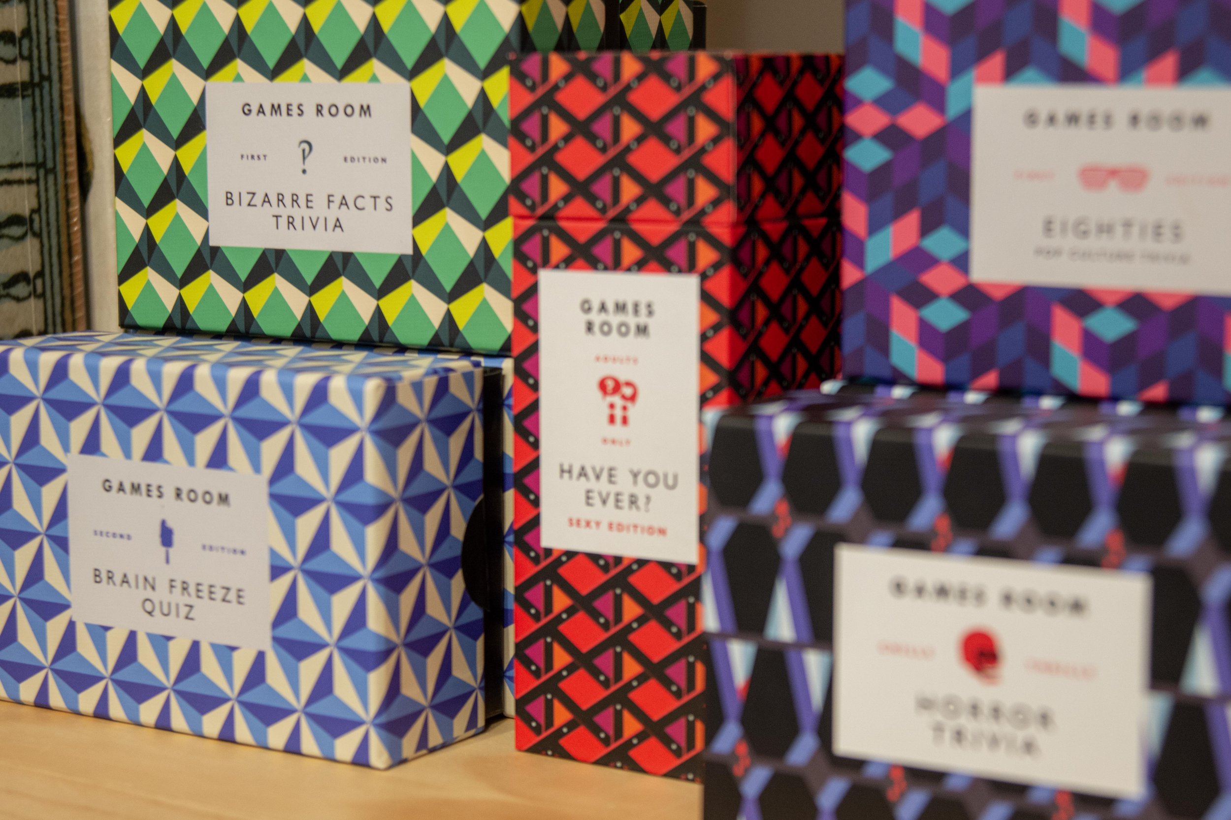 Games Room offers a collection of thoughtfully designed trivia, puzzles, and classic games, packaged in graphic, giftable formats that bring a modern edge to game night.