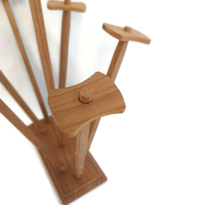 Close-up photo of a plastic baggie drying rack, seen from above against a white background.