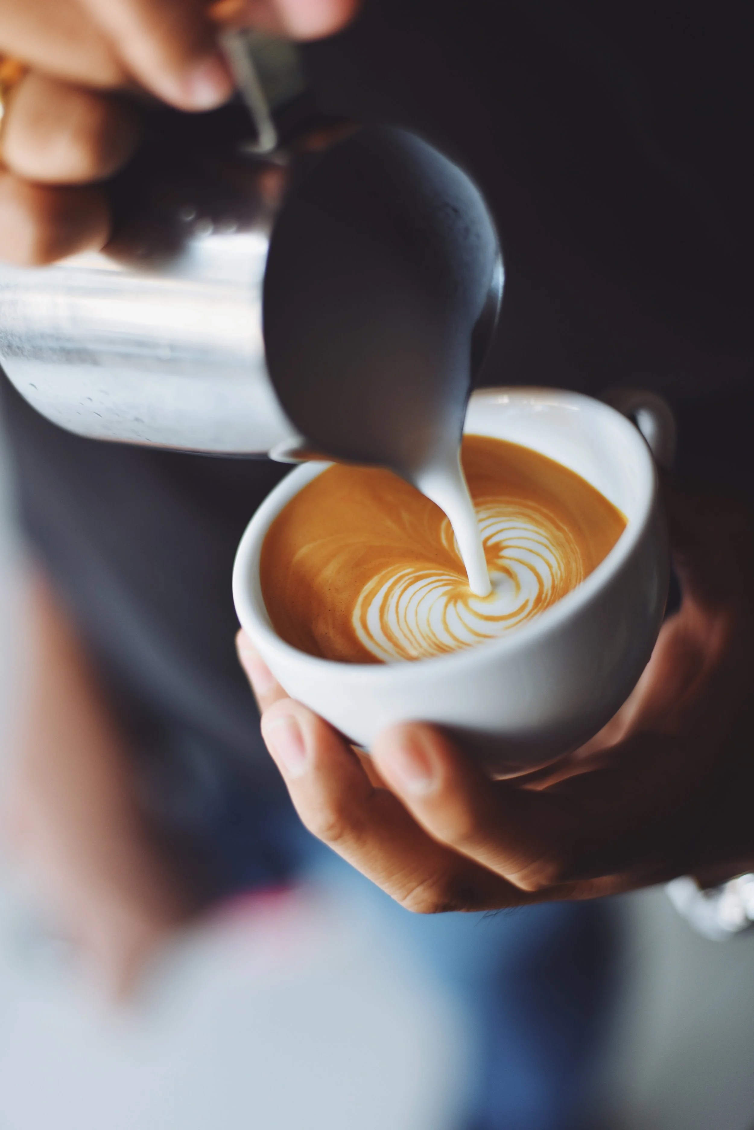 person-serving-cup-coffee.jpg