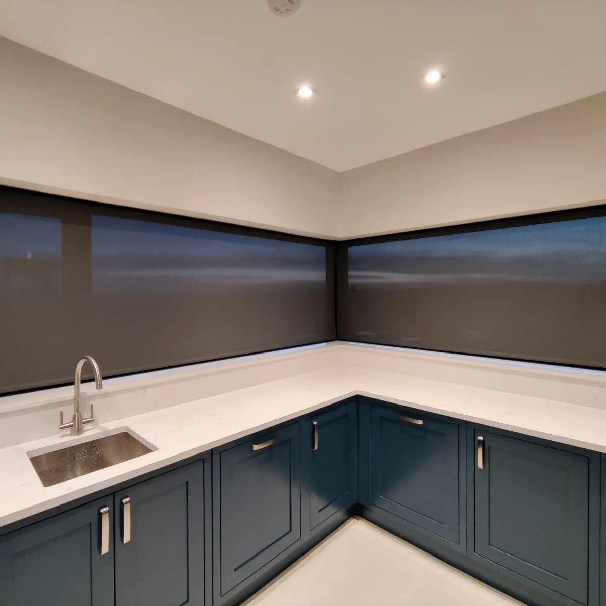 Black perspective roller blinds. Measurements are as tight as possible to have no glass shown by the corner pillar.