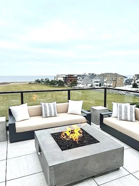 The private roof deck at The Reef has a fire pit, seating area and ocean views.