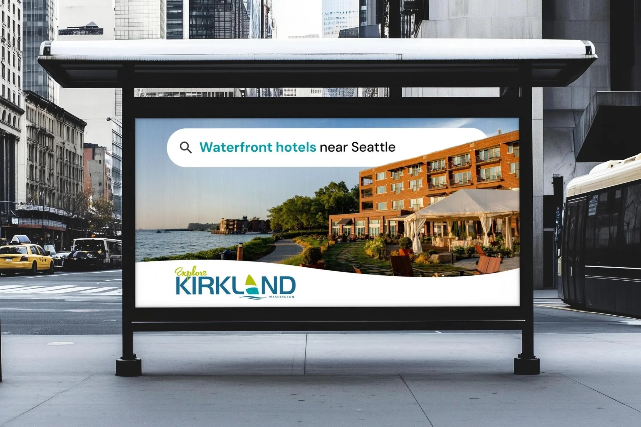 Digital billboard advertising waterfront hotels near Seattle in Kirkland, Washington, featuring a view of water, trees, and a brick hotel building with outdoor seating area.