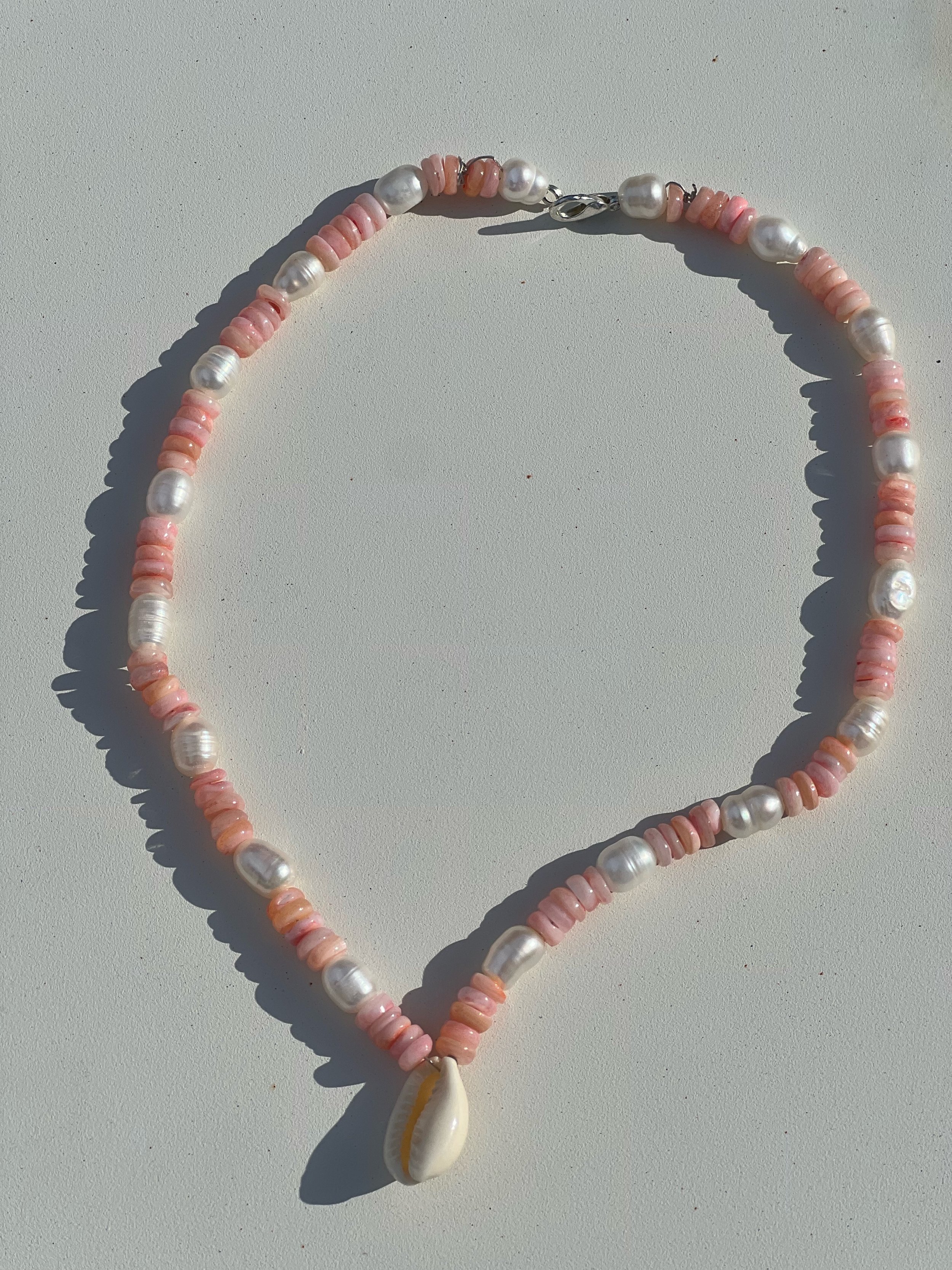 PinkAndPearlwith cowrie.jpeg