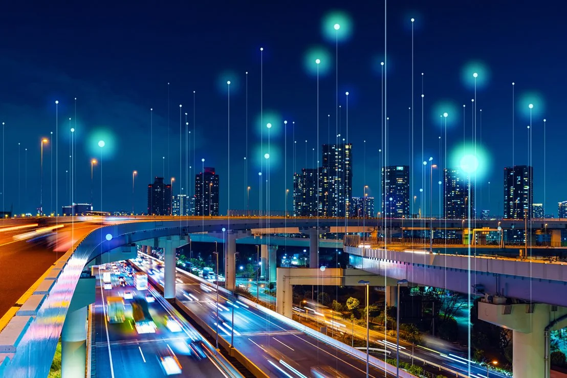 Artist's concept of a smart city, with skyscrapers and busy highways.