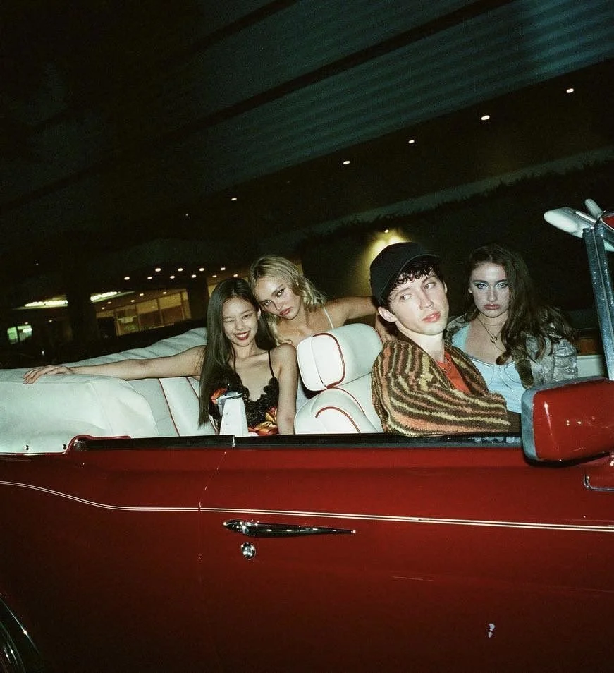 red car with friends in it