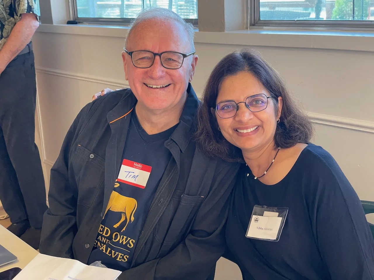 Tim and Vibha greet our members