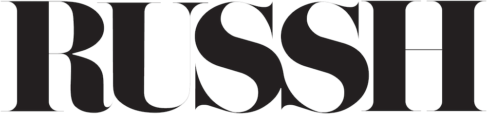 The word "RUSH" written in large, white, outlined letters on a black background.