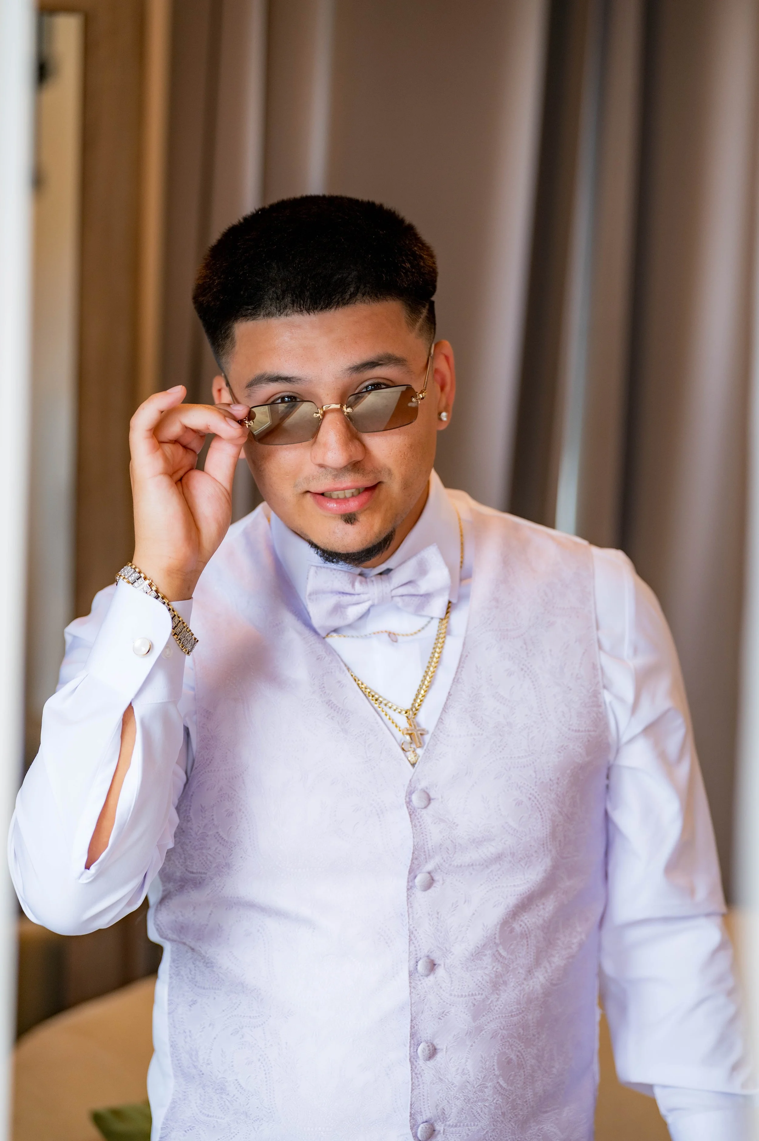 Groom adjusting his sunglasses while getting ready, documentary wedding photographer Tacoma Washington