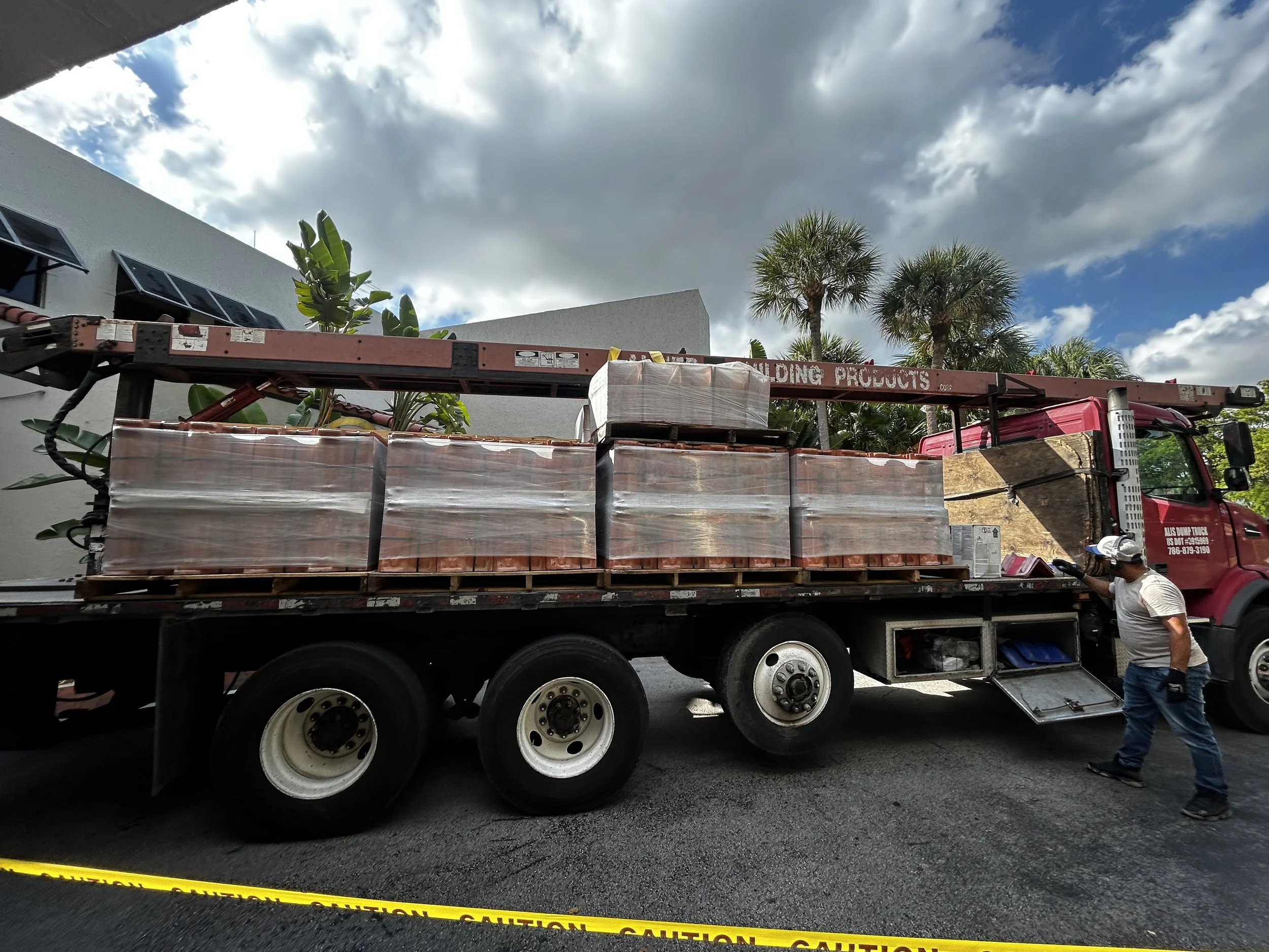 Reroof in progress at Miami Lakes Hotel. Roof tile delivery + placement