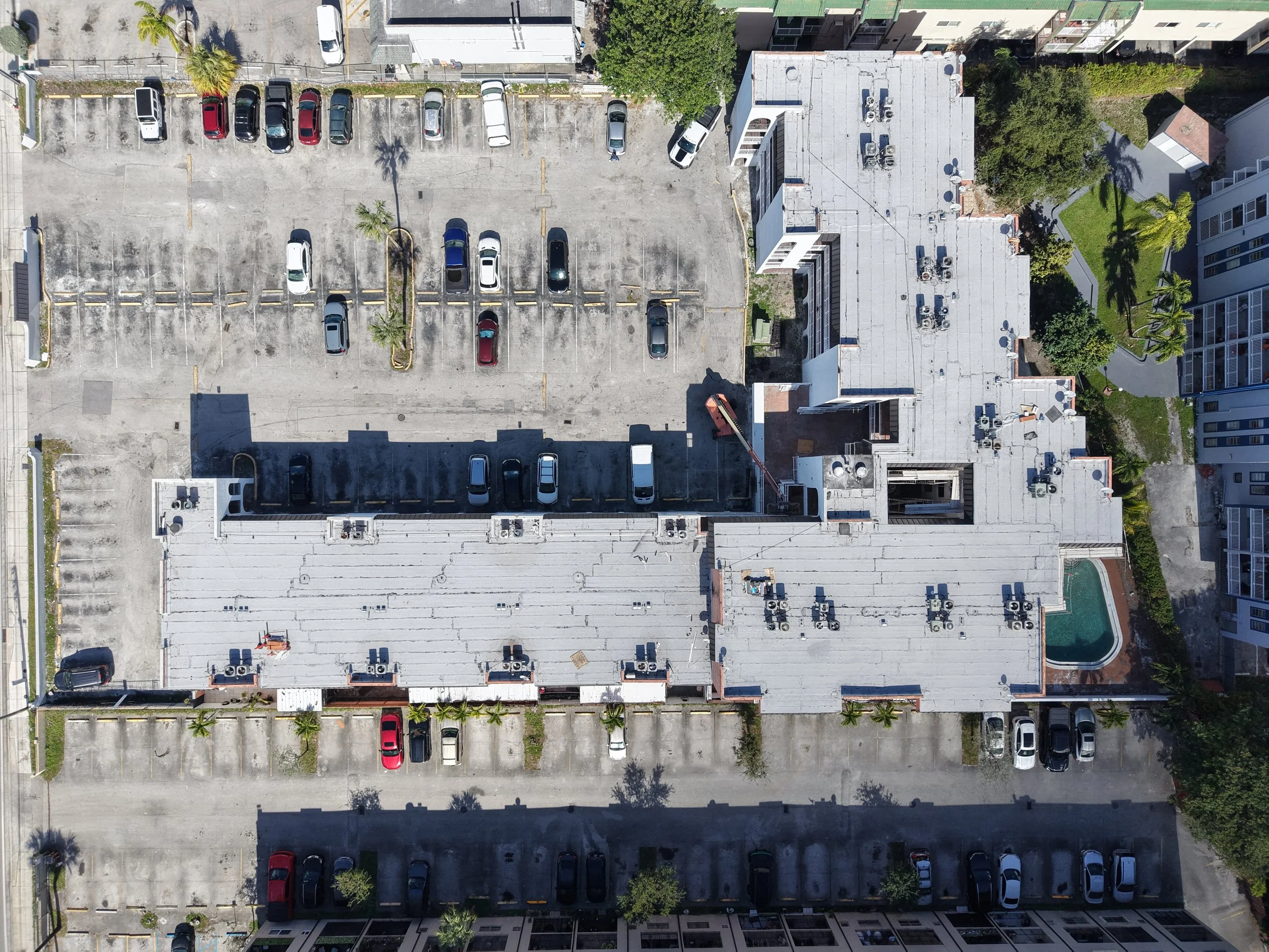 New flat roof system & new metal panel roofs throughout the whole building in Hialeah, Fl