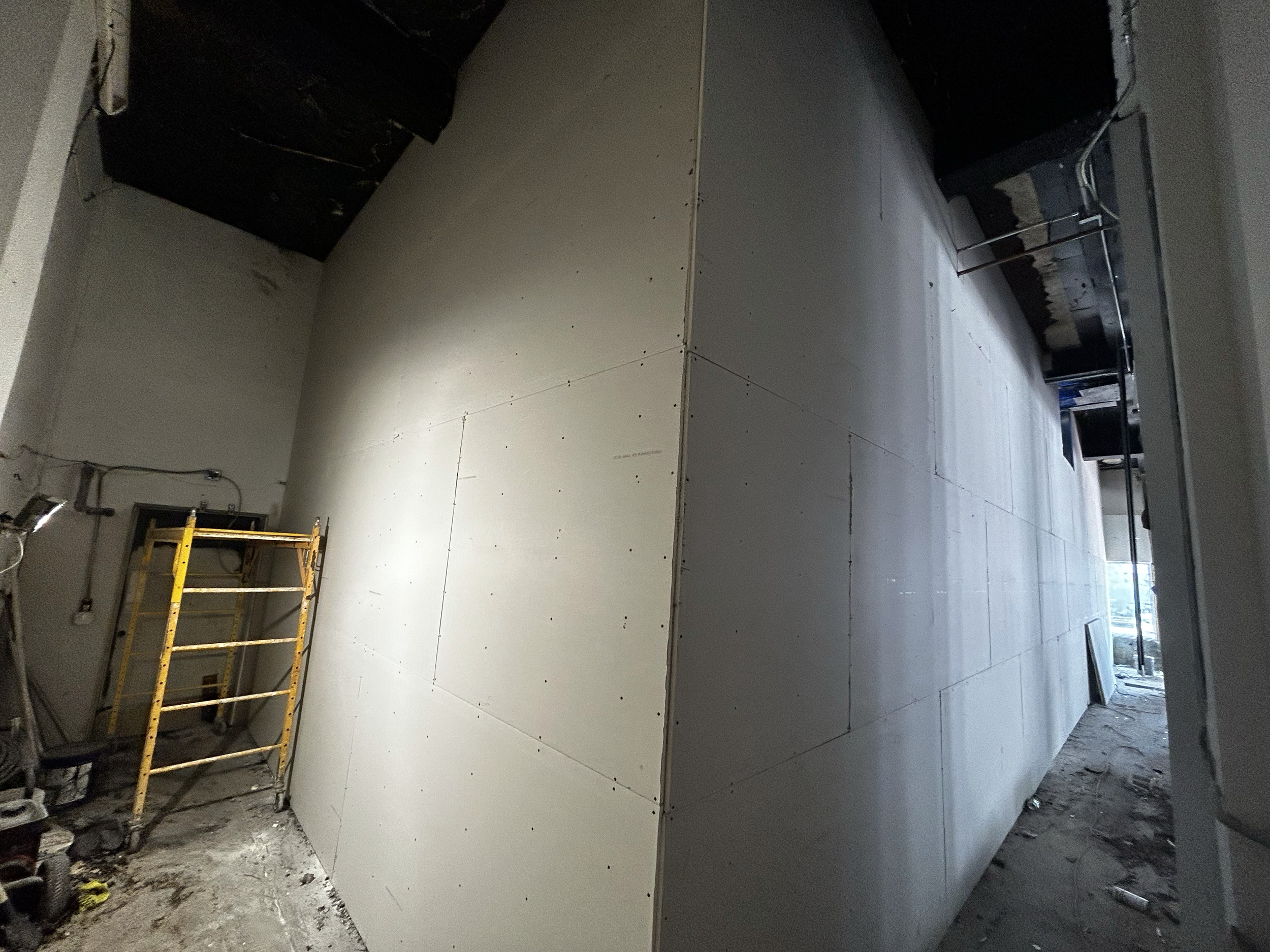 Dry wall installation in AT&T on Collins Ave