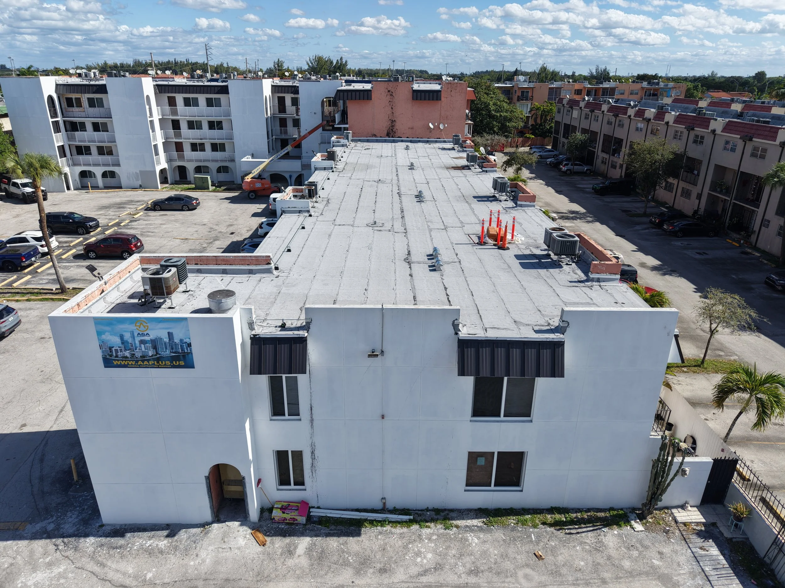 New flat roof system & new metal panel roofs throughout the whole building in Hialeah, Fl