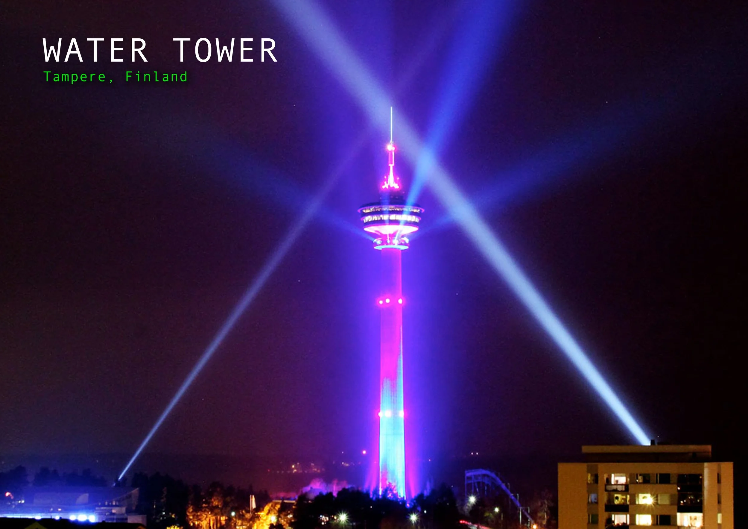 Night view of Tampere, Finland with the Water Tower illuminated in purple and pink lights by Kari Kola with beams of light shining from the top.
