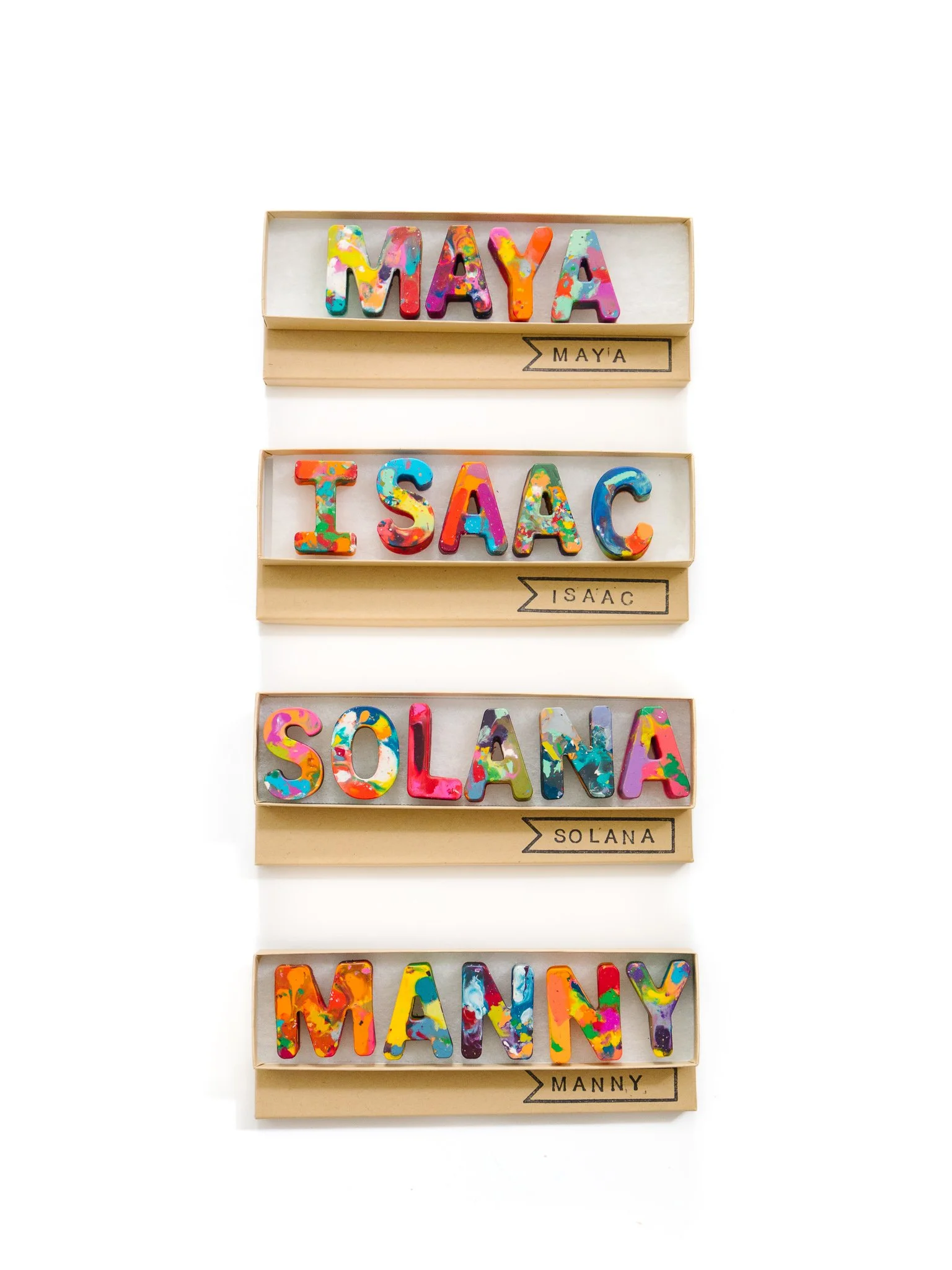 Crayons displayed i nthe shapes of letters that slepp out names: Maya, Isaac, Solana, and Manny.