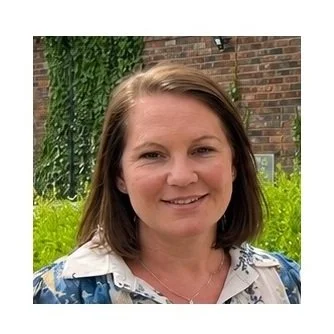 Woman with dark shoulder length hair