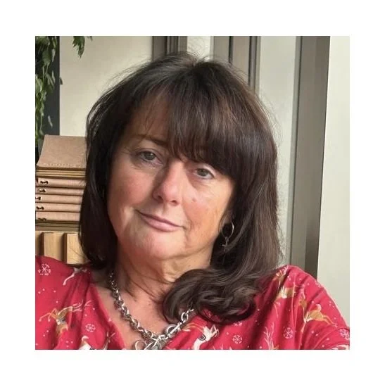 Dark haired woman wearing red top