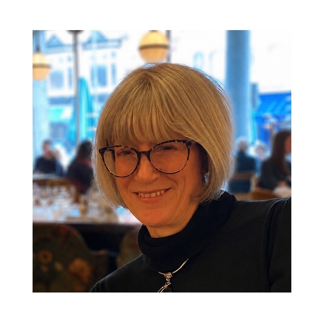 Silver haired woman wearing glasses