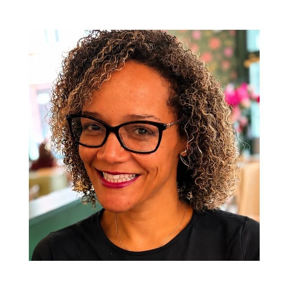 Woman with curly hair smiling