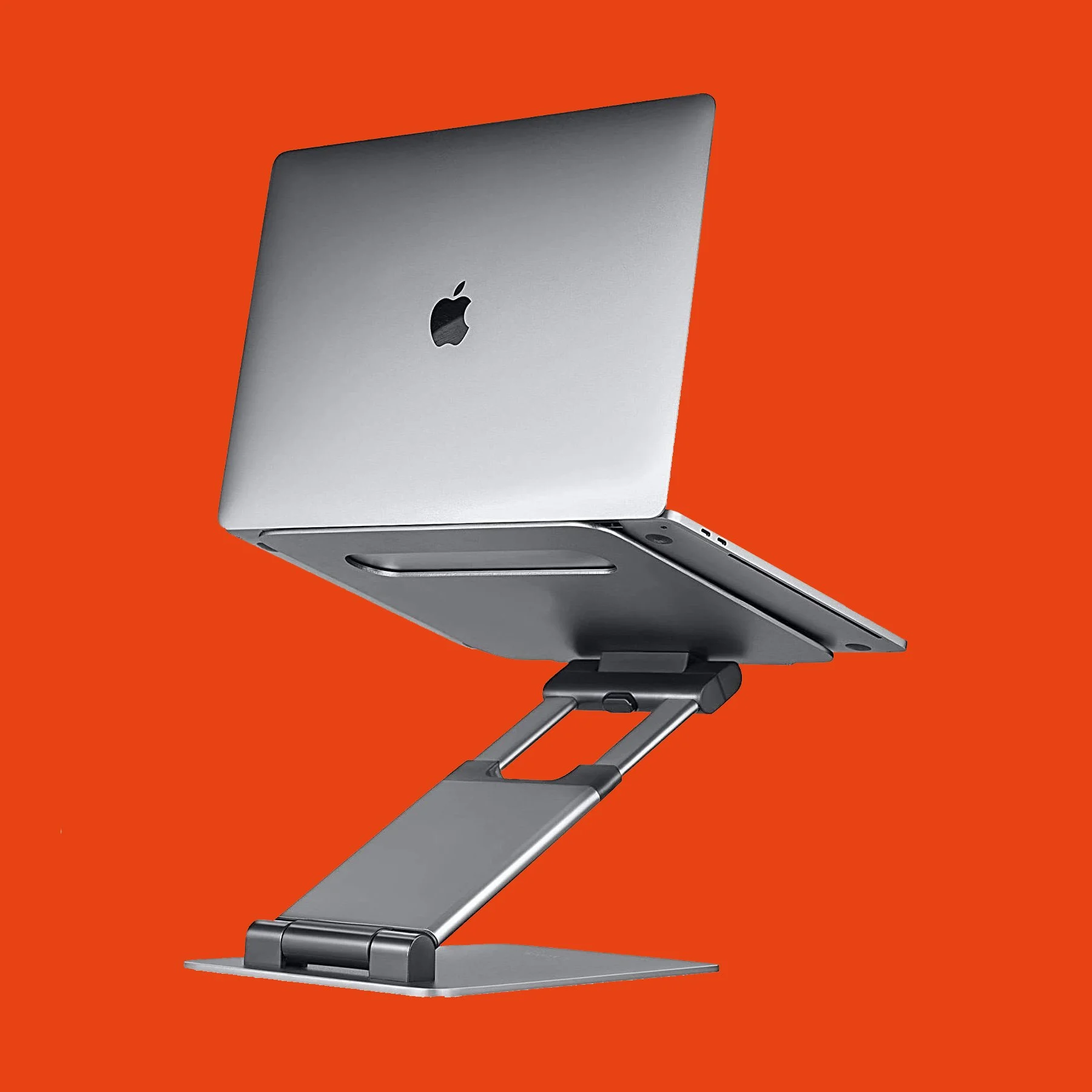 Silver laptop on an adjustable laptop stand