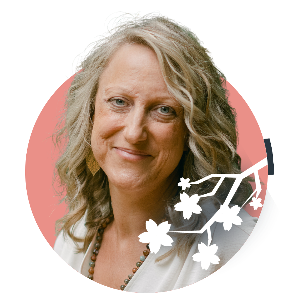 Thumbnail image of Clinical Director Cree Lambeck: A woman with blonde wavy hair and blue eyes wearing earrings and a pink top, with a stylized pink cherry blossom branch graphic overlay.