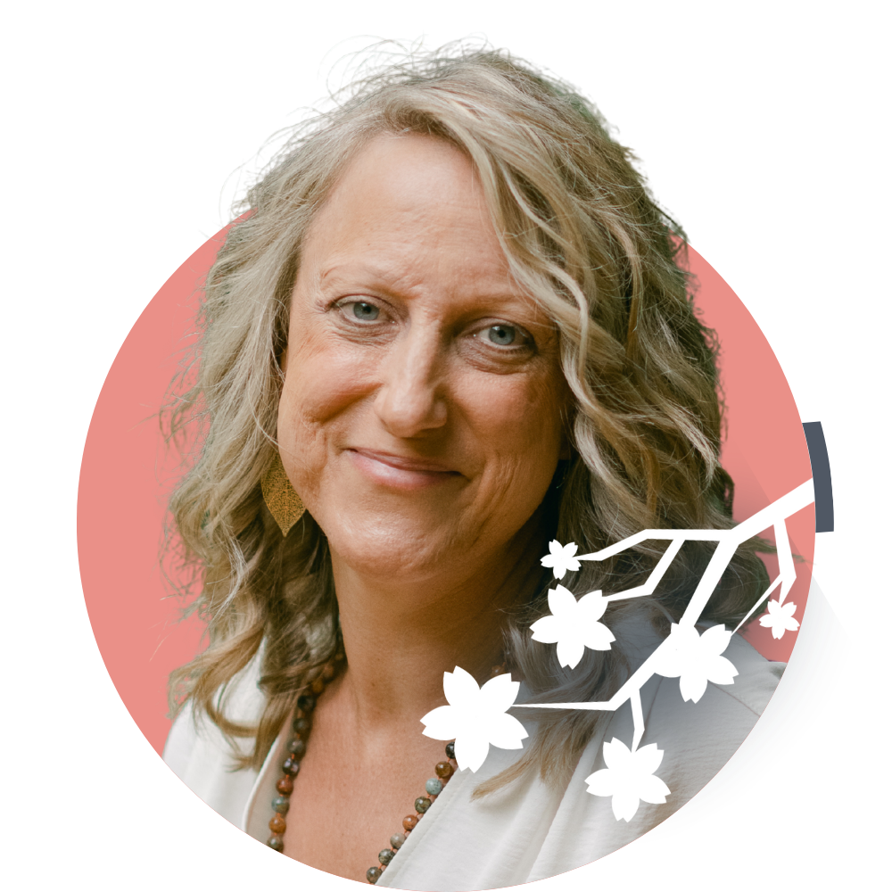 Thumbnail image of Clinical Director Cree Lambeck: A woman with blonde, wavy hair, smiling, wearing earrings and a necklace, with a pink background and white floral graphic overlay.