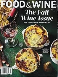Cover of Food & Wine magazine featuring the fall wine issue with a bottle of red wine, a wine glass, and two dishes of baked cheese or gratin.