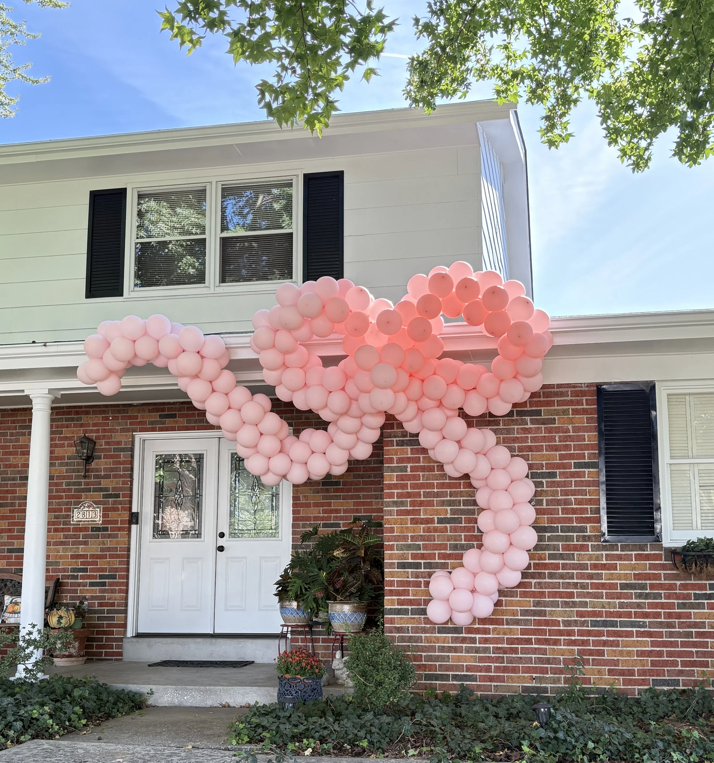 Giant pink balloon bow for girls birthday party