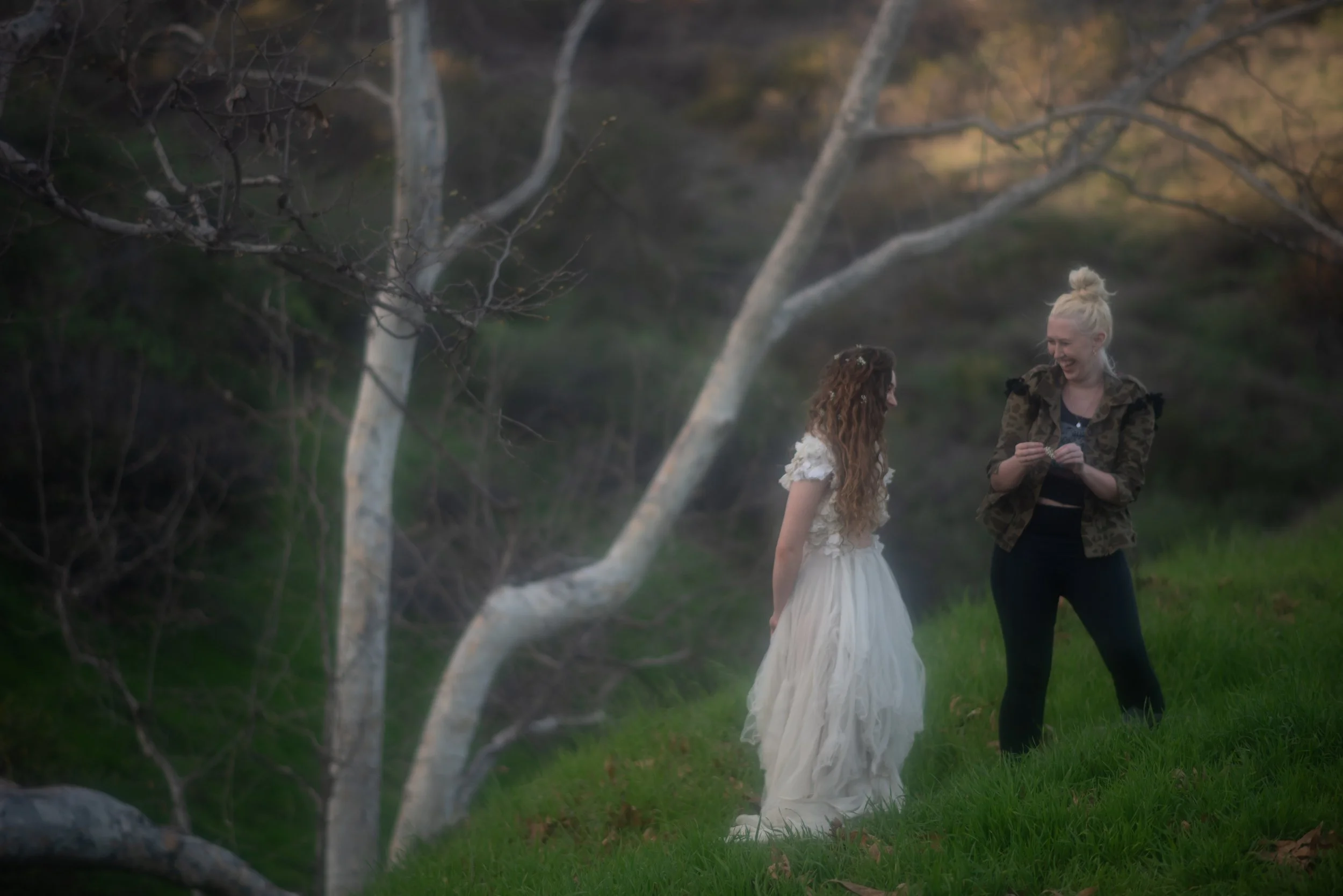 Behind the scenes photo of Chappell Roan and Marianne Bell during a fairy photoshoot.