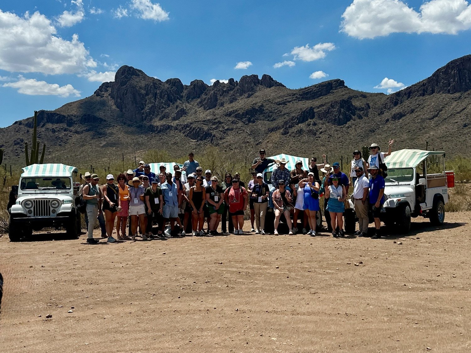 A group enjoying a Trail Dust team-building event in the desert