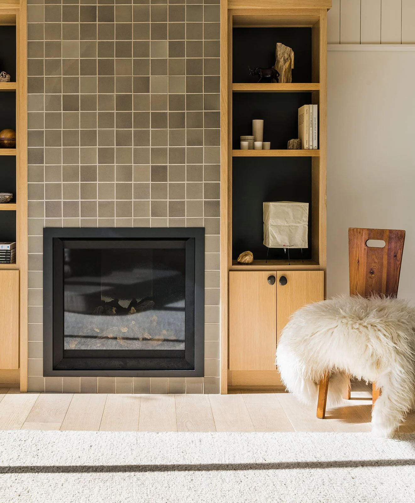 Fireplace with grasscloth ceiling and natural wood living space, Shade Hill Country home